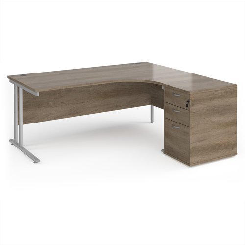 Maestro 25 right hand ergonomic desk 1800mm with silver cantilever frame and desk high pedestal - Nebraska Oak Maestro 25 right hand ergonomic desk 1800mm with silver cantilever frame and desk high pedestal - Nebraska Oak