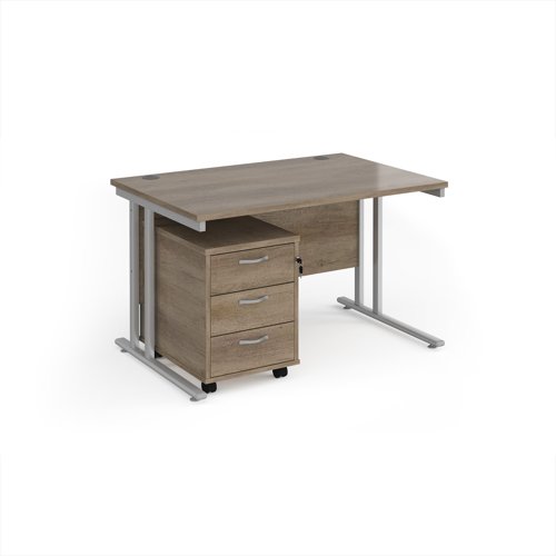 Maestro 25 straight desk 1200mm x 800mm with silver cantilever frame and 3 drawer pedestal - Nebraska Oak Maestro 25 straight desk 1200mm x 800mm with silver cantilever frame and 3 drawer pedestal - Nebraska Oak